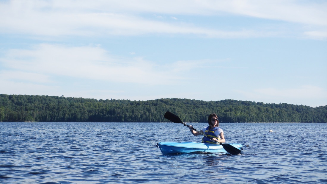 kayaker on lake